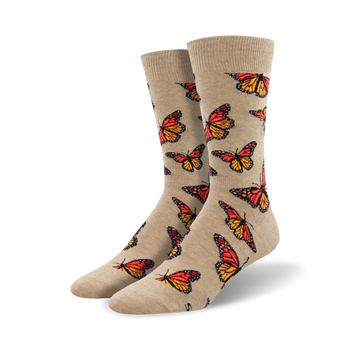 beige crew socks with all-over monarch butterfly pattern in bright orange, black, and yellow.  