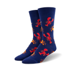 Pair of crew socks with a navy blue background and a repeating pattern of red lobsters and orange crabs.