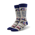 A pair of crew socks in grey with navy blue cuffs. The socks feature a repeating pattern of books on shelves and the text 'So many books, so little time'.