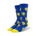 Pair of blue crew socks with a pattern of yellow melting smiley faces.  The socks have a yellow heel and toe.