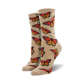 Pair of women's crew socks.  Beige and orange monarch butterflies are printed on a light beige background. Fun and colorful.