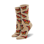Pair of women's crew socks.  Beige and orange monarch butterflies are printed on a light beige background. Fun and colorful.