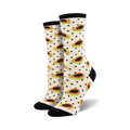 Pair of cream crew socks with orange papaya slices and black polka dots. Black heel and toe.