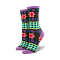A pair of women's crew socks in dark gray with a pattern of coral and purple flowers, green gingham, and purple accents.