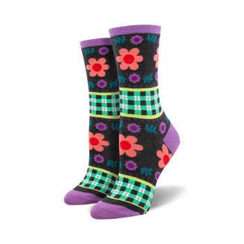  black crew socks with colorful floral pattern, gingham check background, purple toe and heel. women's, botanical theme.    