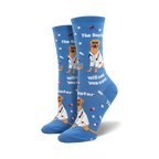Lifestyle shot: Model wearing blue 'The Dogtor Is In' socks. Shows the socks' fit and style on a foot.