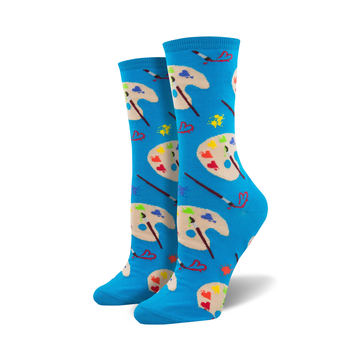 A pair of women's crew socks in bright blue. The design showcases colorful artist palettes, paintbrushes, and small hearts.