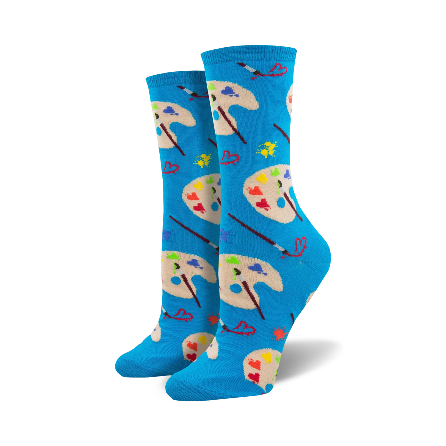 A pair of women's crew socks in bright blue. The design showcases colorful artist palettes, paintbrushes, and small hearts.