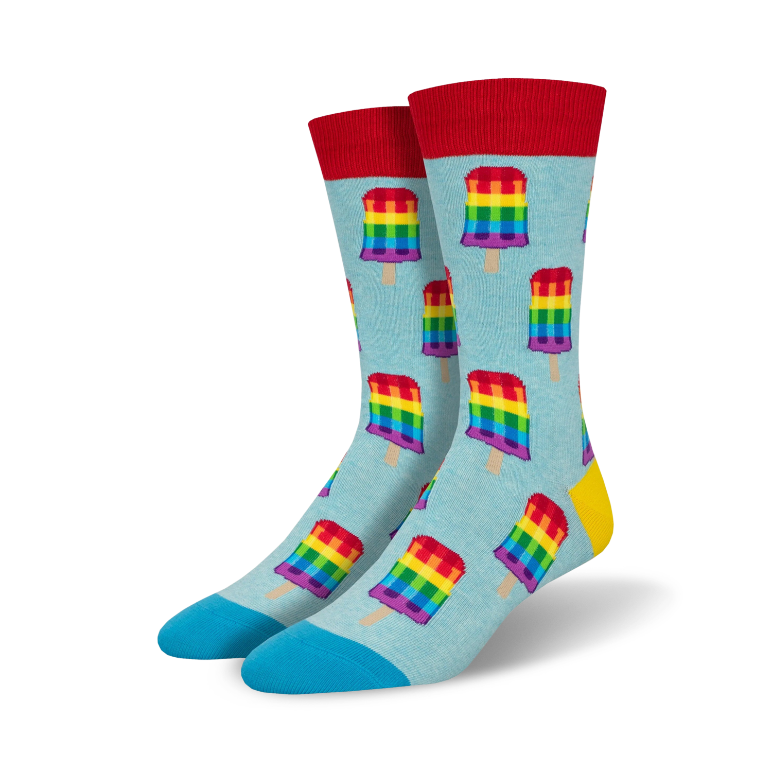 Pair of crew socks with a light blue background featuring repeating rainbow popsicle designs. Red, yellow, and blue accents.