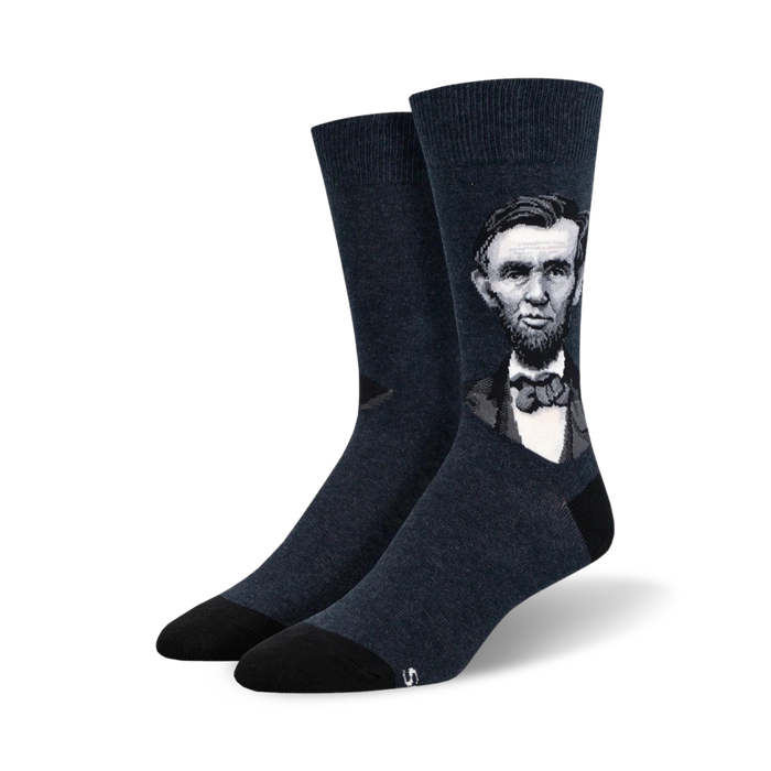 dark blue crew socks feature a pattern of president lincoln's face.    }}