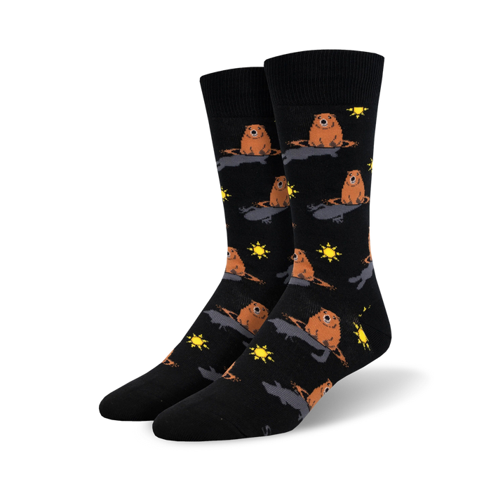 black crew socks featuring a pattern of brown groundhogs popping out of black holes in the ground with yellow suns.   }}