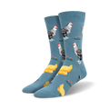 Pair of crew socks; blue background with illustrated black and white hens and yellow chicks. 