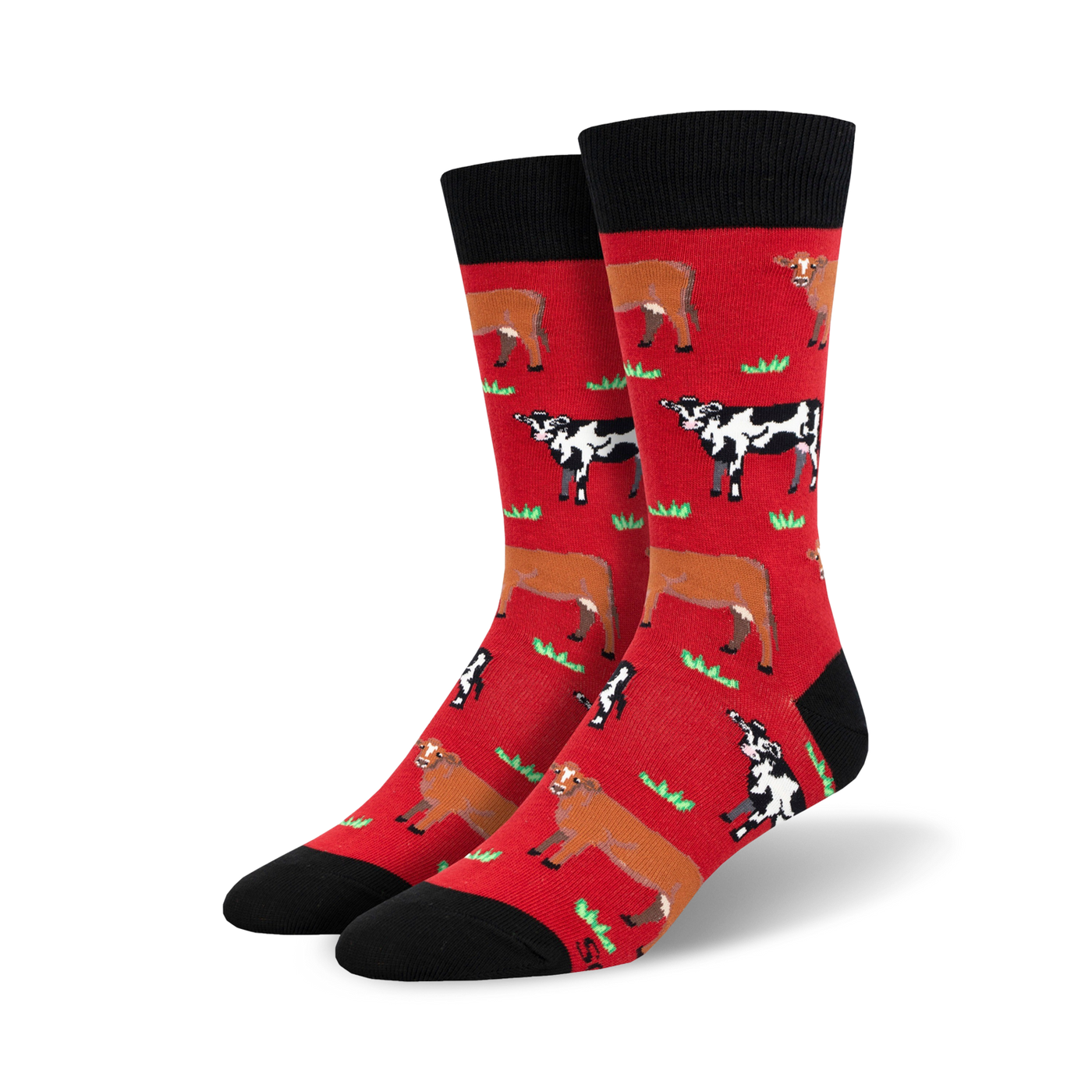 Pair of crew socks; red and black with repeating pattern of brown and black cows in a grassy field.