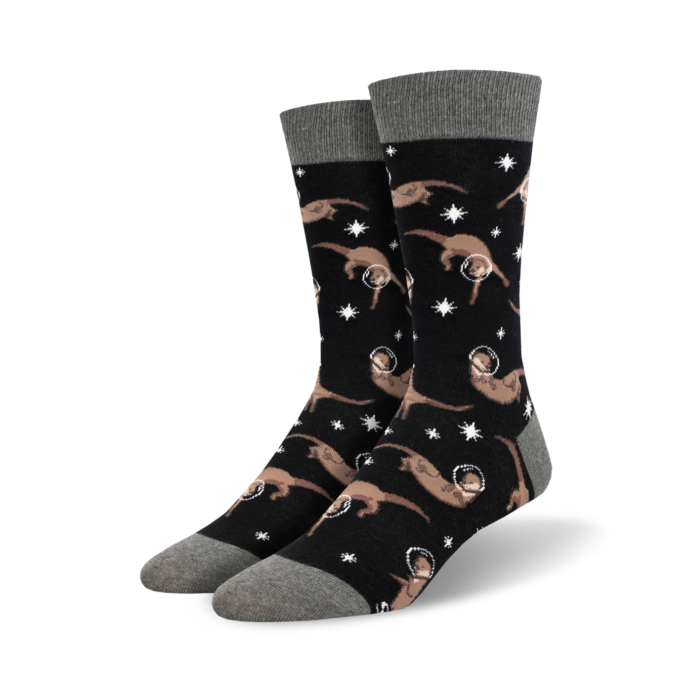 Pair of black crew socks with a pattern of tan otters wearing astronaut helmets and floating amongst white stars.