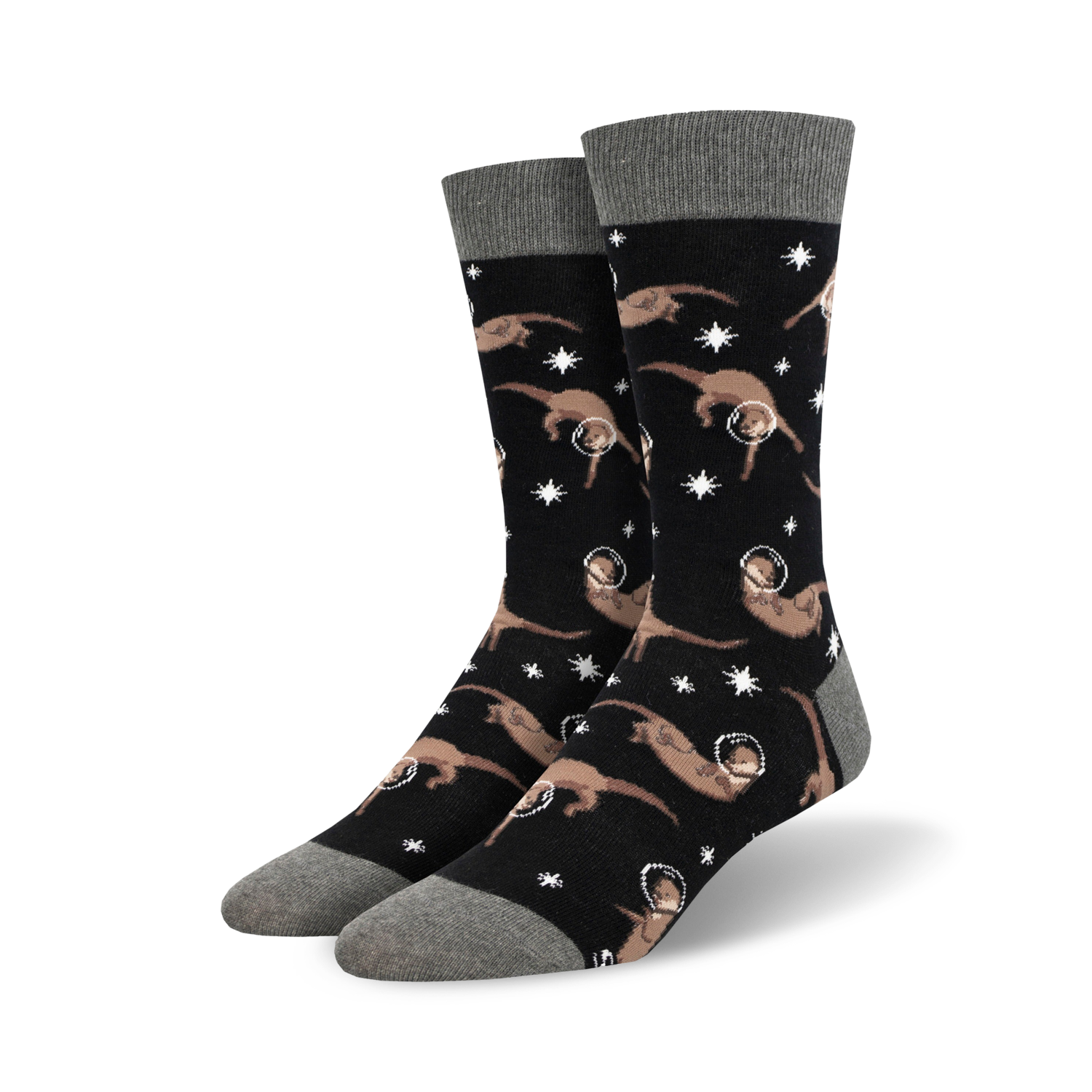 Pair of black crew socks with a pattern of tan otters wearing astronaut helmets and floating amongst white stars.