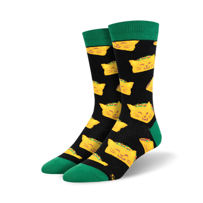 black crew socks with yellow cartoon cat faces wearing tacos on their heads.   