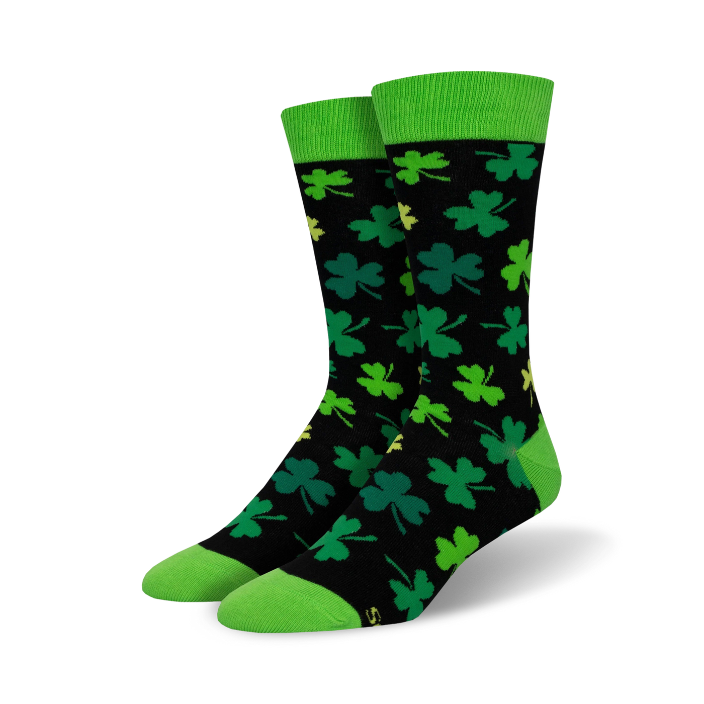A pair of black crew socks with green shamrocks and lime green cuffs. The socks have a fun, playful design perfect for St. Patrick's Day.