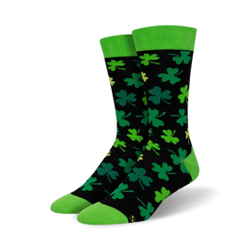 black crew socks emblazoned with four-leaf clovers in green with yellow outlines, solid bright green top. men's. st. patrick's day theme.   