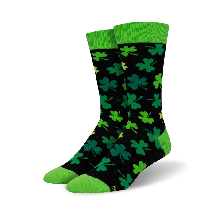 black crew socks emblazoned with four-leaf clovers in green with yellow outlines, solid bright green top. men's. st. patrick's day theme.    }}