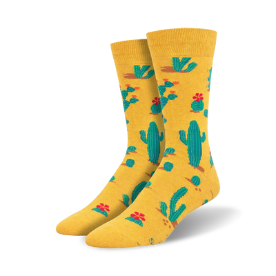  crew length men's socks with a pattern of green cacti and red flowers on a yellow background.   