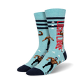 Pair of crew socks; light blue with navy details, red stripes, and pixelated lucha libre wrestlers; text reads 'Lucha Libre'.