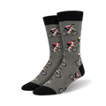 Pair of crew socks; gray with repeating cyclist pattern, black cuffs; or light blue with navy cuffs and same cyclist pattern.