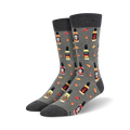 Pair of crew socks in gray and black, featuring a repeating pattern of hot sauce bottles, chili peppers, and skull graphics.