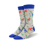 Pair of crew socks in gray with a blue cuff.  The socks feature a repeating pattern of colorful, geometric cornhole board designs.