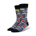 A pair of crew socks in dark gray with a pattern of colorful vintage camper vans and the words 'Get Lost'.