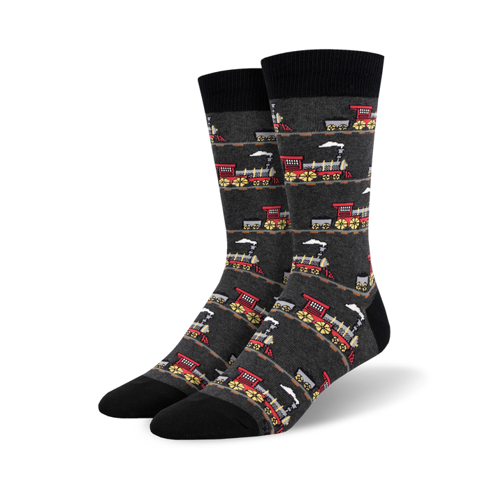 crew length black socks for men with a red and yellow steam locomotive print on a gray background.  