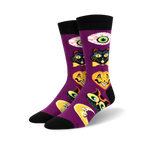 Purple crew socks with a Halloween theme. Features black cats, pumpkins, moons, and eyes in vintage-style illustrations.