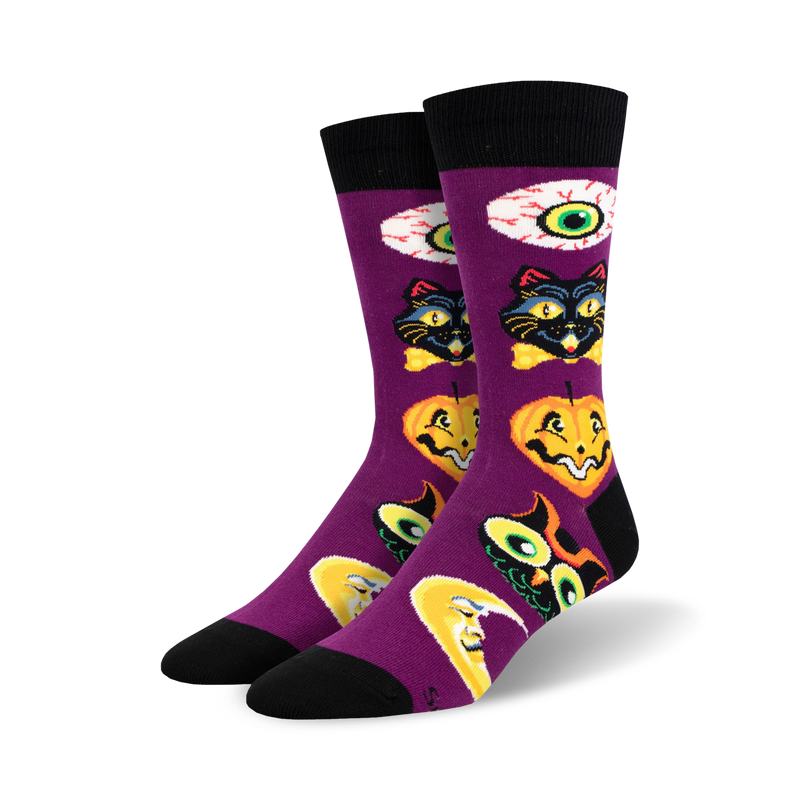 Purple crew socks with a Halloween theme. Features black cats, pumpkins, moons, and eyes in vintage-style illustrations.