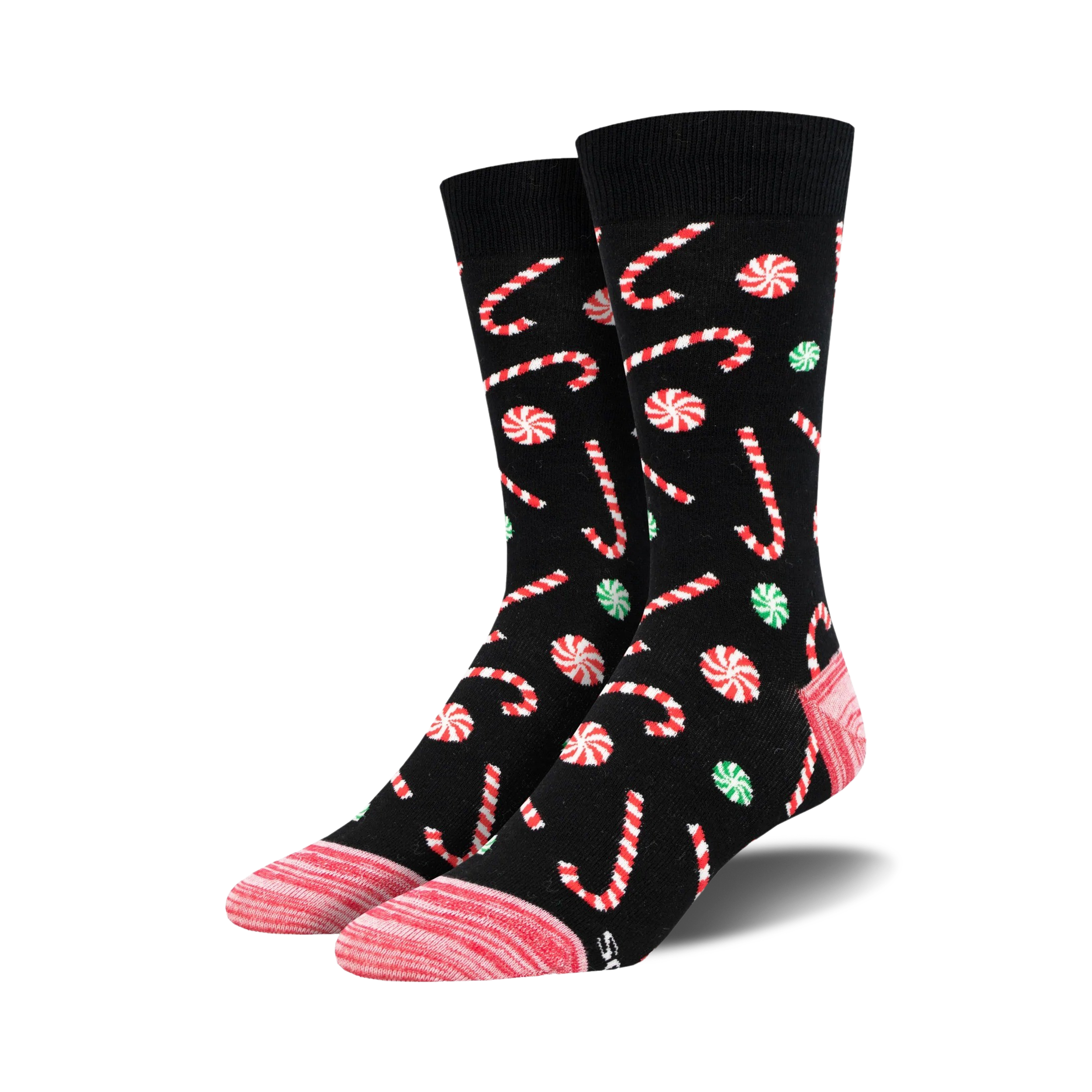 Pair of crew socks with a black background, adorned with red and white candy canes and green and red peppermint swirls.