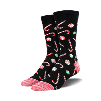 christmas candy cane patterned crew socks in black, red, green, and pink. unisex adult size.  