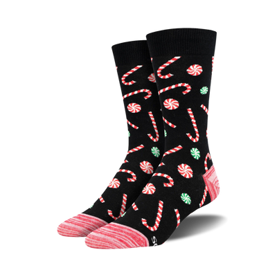 christmas candy cane patterned crew socks in black, red, green, and pink. unisex adult size.  