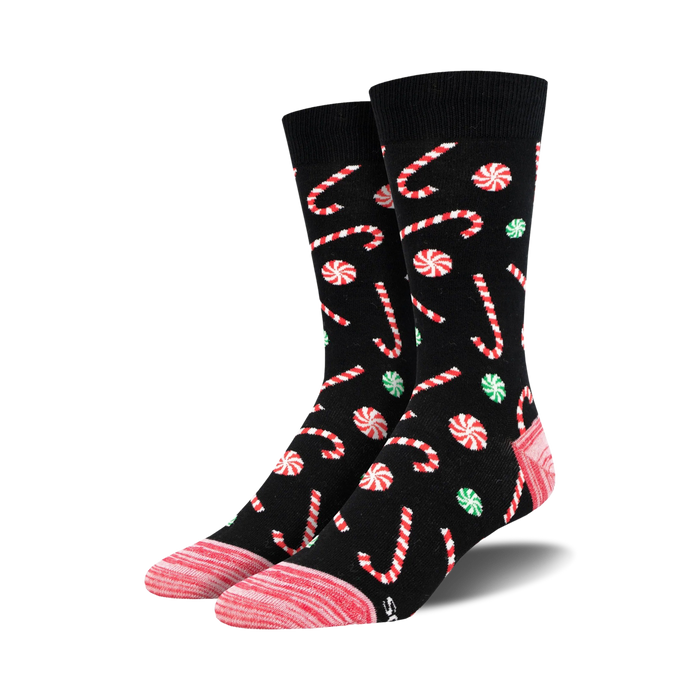 christmas candy cane patterned crew socks in black, red, green, and pink. unisex adult size.   }}