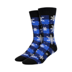Pair of crew socks in blue and black buffalo plaid with white snowflake design. 