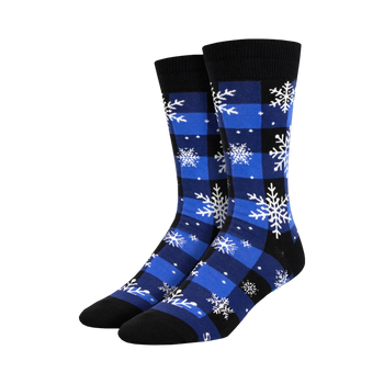 Pair of crew socks in blue and black buffalo plaid with white snowflake design. 