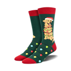 A pair of crew socks in green with red cuffs. The design features a golden retriever wearing a Santa hat and wrapped in Christmas lights.