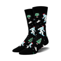 A pair of black crew socks with a whimsical Christmas design.  Features light blue Yetis in Santa hats, green Christmas trees, and candy canes.