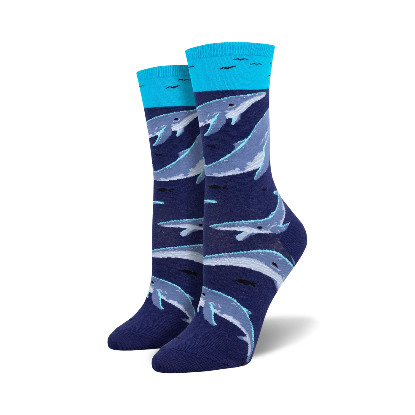 A pair of women's crew socks in navy blue and teal. The socks feature a pattern of whales swimming underwater.