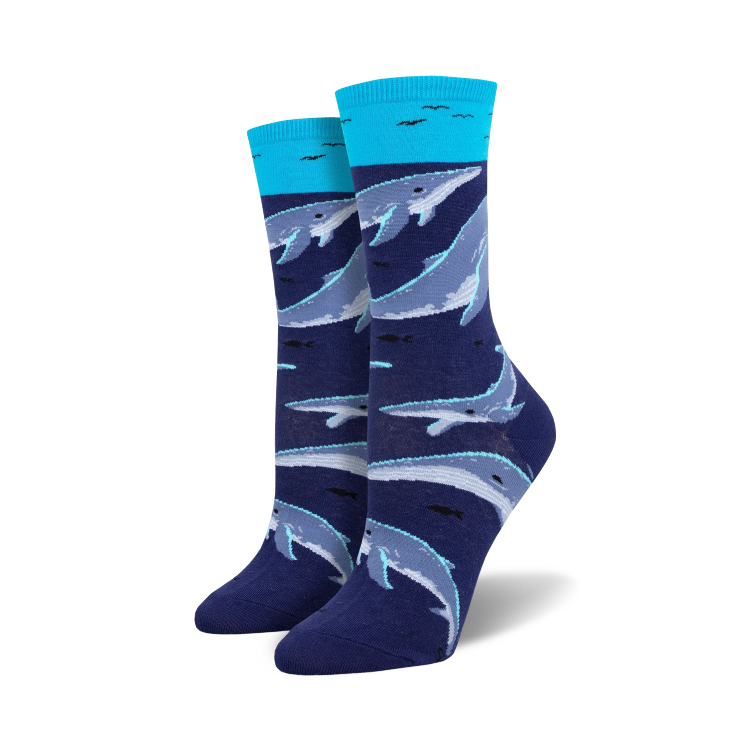A pair of women's crew socks in navy blue and teal. The socks feature a pattern of whales swimming underwater.