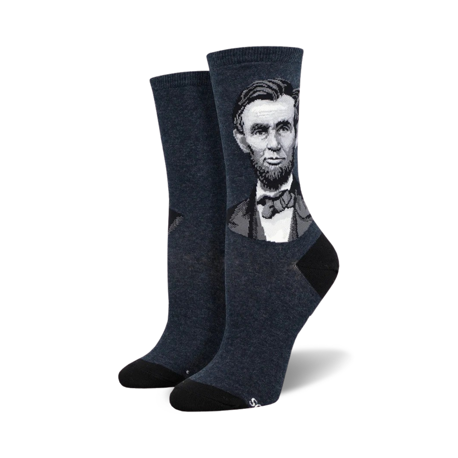 A pair of women's crew socks in dark blue featuring a grayscale portrait of Abraham Lincoln. The socks have black heels and toes.
