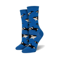Pair of women's crew socks in bright blue, adorned with a repeating pattern of black and white orca whales.