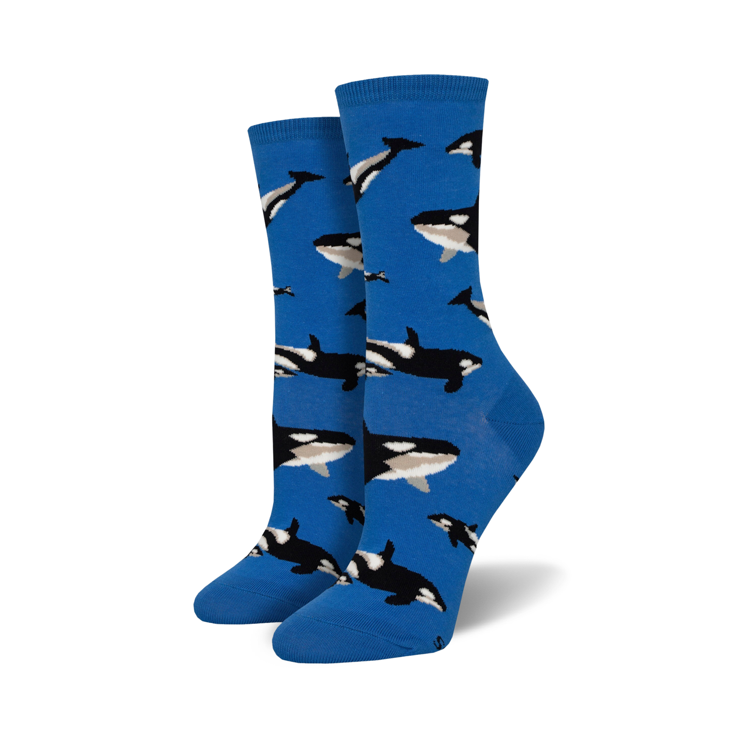 Pair of women's crew socks in bright blue, adorned with a repeating pattern of black and white orca whales.