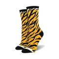 Pair of crew socks in orange and black with a tiger stripe pattern.  Black toe and heel.