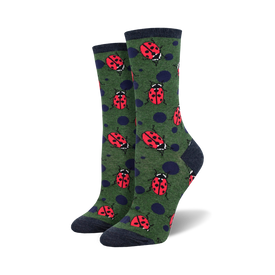 dark green crew socks featuring repeating pattern of bright red ladybugs with black spots. perfect for women who love ladybugs.  