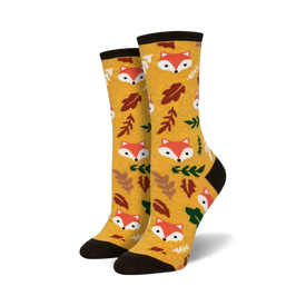 yellow crew socks with cartoon foxes and fall leaves pattern.   