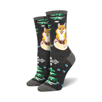 dark gray crew socks with a pattern of green pine trees, red mushrooms, and a cartoon fox sitting in the snow.  
