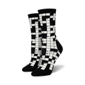 Pair of black and white crew socks featuring a crossword puzzle design.  The numbers are clearly visible against the contrasting background.